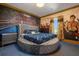Unique bedroom with boxing ring mural, a round bed, and Rocky Balboa themed artwork at 1021 Fantasy Dr, Davenport, FL 33896