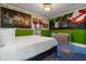 Themed bedroom with bold colors, unique murals, and designer furnishings at 1021 Fantasy Dr, Davenport, FL 33896