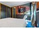 Comfortable bedroom with king bed, television, and custom mural decor, creating an immersive atmosphere at 1021 Fantasy Dr, Davenport, FL 33896