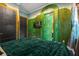 Themed bedroom featuring unique decor, including a television and vibrant green walls for an enchanting space at 1021 Fantasy Dr, Davenport, FL 33896