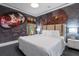 Unique bedroom with dark and moody textures, creative murals, and designer furnishings at 1021 Fantasy Dr, Davenport, FL 33896