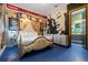 Bright bedroom with a golden decorative bed, Hollywood themed wall paper, and a Marilyn Monroe mural at 1021 Fantasy Dr, Davenport, FL 33896