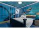 Ocean themed bedroom with custom wall painting and furniture accents at 1021 Fantasy Dr, Davenport, FL 33896
