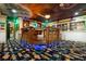 Game room featuring unique decor, multi-level platform, television, and movie posters for entertainment at 1021 Fantasy Dr, Davenport, FL 33896