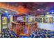 A spacious and themed room featuring a multi-level wooden platform, colorful decor and Hollywood memorabilia at 1021 Fantasy Dr, Davenport, FL 33896