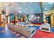 Entertainment room featuring movie-themed decor, ample seating, and a projection screen for immersive viewing experiences at 1021 Fantasy Dr, Davenport, FL 33896