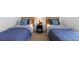 Cozy bedroom featuring two twin beds with blue and gray accents, creating a relaxing retreat at 503 Balmoral Dr, Davenport, FL 33896