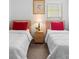 Comfortable bedroom with two twin beds, side table and lamps, offering a cozy and inviting space at 503 Balmoral Dr, Davenport, FL 33896