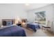 Cozy bedroom with twin beds, neutral walls, natural light, and comfortable furnishings at 503 Balmoral Dr, Davenport, FL 33896