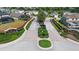 An aerial view of the community entrance, complete with brick signage and manicured landscaping at 503 Balmoral Dr, Davenport, FL 33896