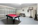 A versatile garage space featuring a pool table, foosball, and basketball hoop for entertainment at 503 Balmoral Dr, Davenport, FL 33896