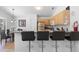 Modern kitchen with stainless steel appliances and granite countertops, and bar seating at 503 Balmoral Dr, Davenport, FL 33896