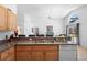 Bright kitchen featuring granite countertops and stainless-steel sink, perfect for cooking and entertaining at 503 Balmoral Dr, Davenport, FL 33896
