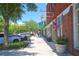 View of a charming downtown street with shops and parked cars at 501 N Dillard St, Winter Garden, FL 34787