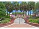 Landscaped park entrance with brick stairs and palm trees at 501 N Dillard St, Winter Garden, FL 34787