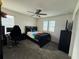 Well-lit bedroom with carpet, ceiling fan, two windows, and simple furnishings that can be personalized to taste at 2346 Upland Ln, Apopka, FL 32712