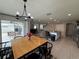 Charming dining area featuring modern chandelier and sliding glass doors to the outdoor seating area at 2346 Upland Ln, Apopka, FL 32712