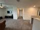Upstairs hallway with carpet looking toward the living room at 2346 Upland Ln, Apopka, FL 32712