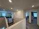 Upstairs hallway view to living room and bedrooms at 2346 Upland Ln, Apopka, FL 32712