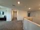 Upstairs hallway with carpet leading to multiple bedrooms at 2346 Upland Ln, Apopka, FL 32712