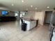 Open-concept kitchen boasts a spacious island, perfect for meal prep and casual dining at 2346 Upland Ln, Apopka, FL 32712