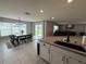 Open-concept kitchen adjacent to the dining room and living area, great for entertaining at 2346 Upland Ln, Apopka, FL 32712