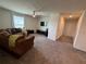 Upstairs living area with couch, television and view to hallway at 2346 Upland Ln, Apopka, FL 32712