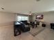 Comfortable living room featuring modern decor, a large window, and an inviting atmosphere for relaxing at 2346 Upland Ln, Apopka, FL 32712