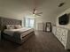 Generous main bedroom offering ample space, plush carpeting, and an abundance of natural light at 2346 Upland Ln, Apopka, FL 32712