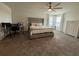 Spacious main bedroom retreat with comfortable king bed, neutral décor, and plenty of natural light at 2346 Upland Ln, Apopka, FL 32712