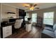Inviting office space with lots of light, featuring a sofa and custom bookshelves at 2346 Upland Ln, Apopka, FL 32712