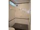 Modern shower area featuring sleek tile work, a built-in shower, and inspirational wall decals for a relaxing experience at 2377 Paulette Dr, Haines City, FL 33844