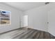 Simple bedroom with gray vinyl flooring and a window at 16941 Sw 30Th Avenue Sw Rd, Ocala, FL 34473