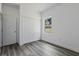Bedroom with gray vinyl flooring and double door closet at 16941 Sw 30Th Avenue Sw Rd, Ocala, FL 34473