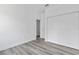 Bedroom with gray vinyl flooring and double door closet at 16941 Sw 30Th Avenue Sw Rd, Ocala, FL 34473