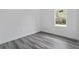 Bedroom with gray vinyl flooring and window at 16941 Sw 30Th Avenue Sw Rd, Ocala, FL 34473