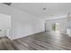 Bright living room with gray vinyl flooring and sliding glass doors at 16941 Sw 30Th Avenue Sw Rd, Ocala, FL 34473