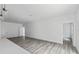 Bright and airy living area with gray vinyl plank flooring and ample natural light at 16941 Sw 30Th Avenue Sw Rd, Ocala, FL 34473