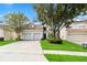 Two-story house with a two-car garage and neatly landscaped yard at 2616 Bowring St, Kissimmee, FL 34747