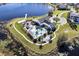 Scenic aerial view of the community pool, playground, and surrounding neighborhood by the lake at 3198 Sailing Pier Ave, Winter Garden, FL 34787