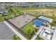 Aerial view of community playground and pool area with parking at 3198 Sailing Pier Ave, Winter Garden, FL 34787