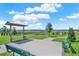 Scenic community park with benches, walking paths, and picturesque water views at 3198 Sailing Pier Ave, Winter Garden, FL 34787