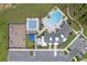 Aerial view of community pool and playground with ample parking and surrounding greenery at 3198 Sailing Pier Ave, Winter Garden, FL 34787