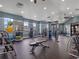 Bright fitness center with ample space, diverse equipment, and large windows at 3198 Sailing Pier Ave, Winter Garden, FL 34787