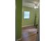 Bedroom with wood floors and light green walls at 108 5Th Jpv St, Winter Haven, FL 33880