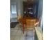 Eat-in breakfast nook featuring tile floors, a wooden table, and a wooden china cabinet at 108 5Th Jpv St, Winter Haven, FL 33880
