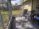 Enclosed patio area with chairs and a grill at 108 5Th Jpv St, Winter Haven, FL 33880