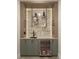 Modern bar area with wine refrigerator, sleek countertop, and stylish shelving with accent lighting at 110 W Railway Ave, Oakland, FL 34760
