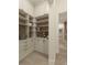Spacious pantry with custom shelving, ample storage, and modern design elements at 110 W Railway Ave, Oakland, FL 34760