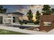 Inviting backyard featuring a modern pool, sunken fire pit, and lounge area with serene sunset views at 110 W Railway Ave, Oakland, FL 34760